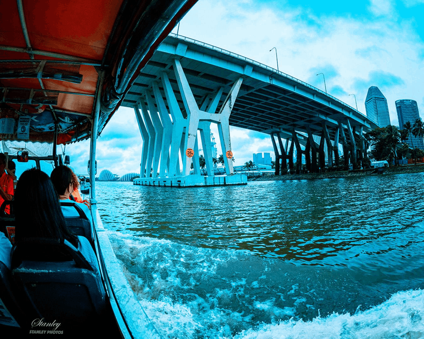 Passengers aboard the Captain Explorer DUKW Tour cruising through Marina Bay with Singapore’s city skyline in view.