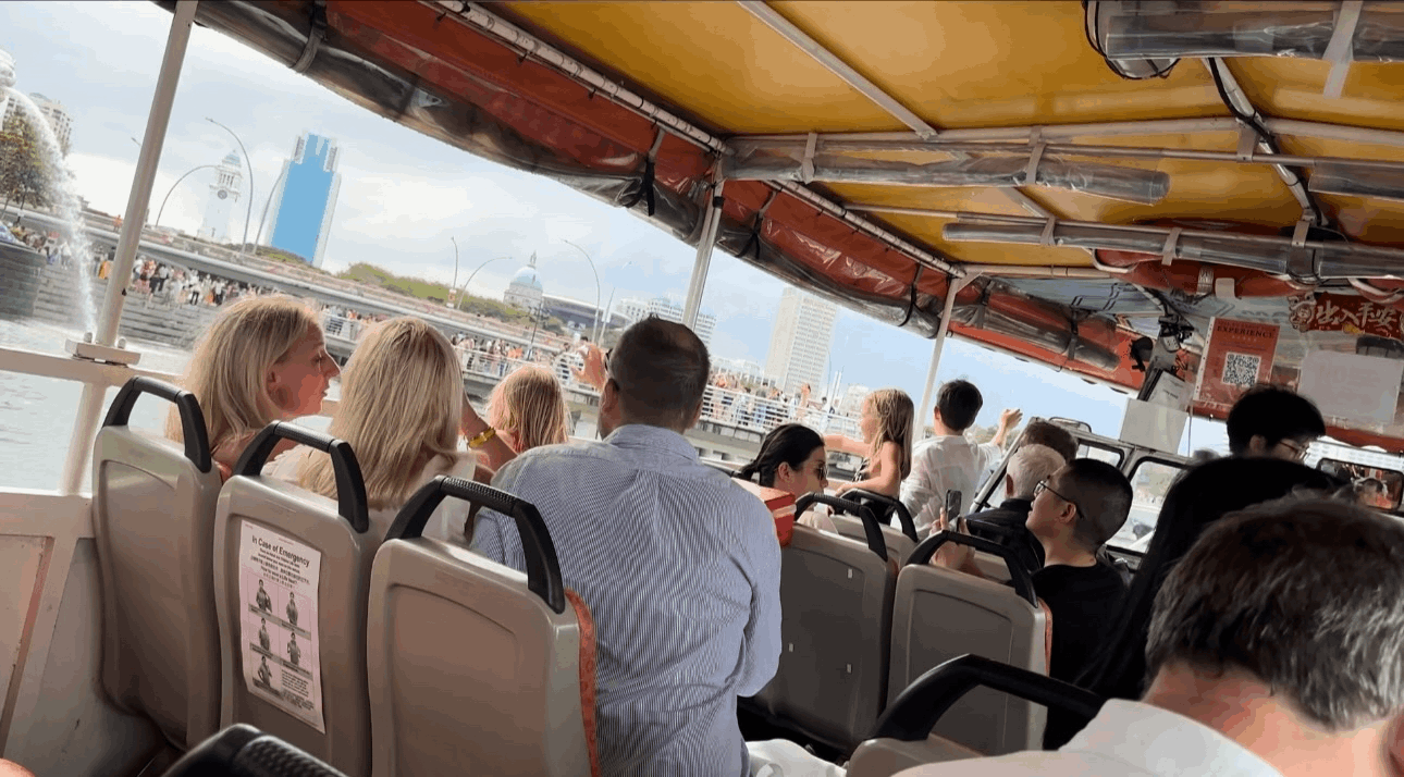 DUKW Tours amphibious vehicle cruising through Singapore, offering a unique city tour by both land and water.