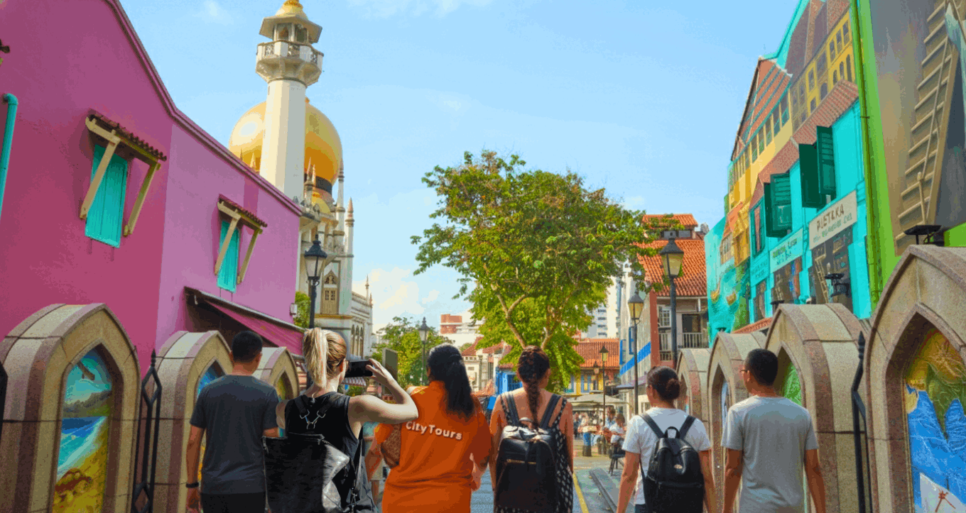 Family exploring Kampong Gelam with the Sultan Mosque in the background, enjoying cultural sights along the vibrant heritage district.