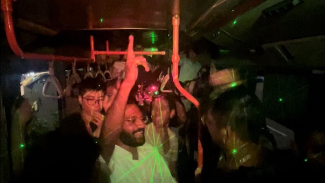 FunVee Party Bus with people celebrating during Singapore’s 2025 New Year Countdown for a unique group experience