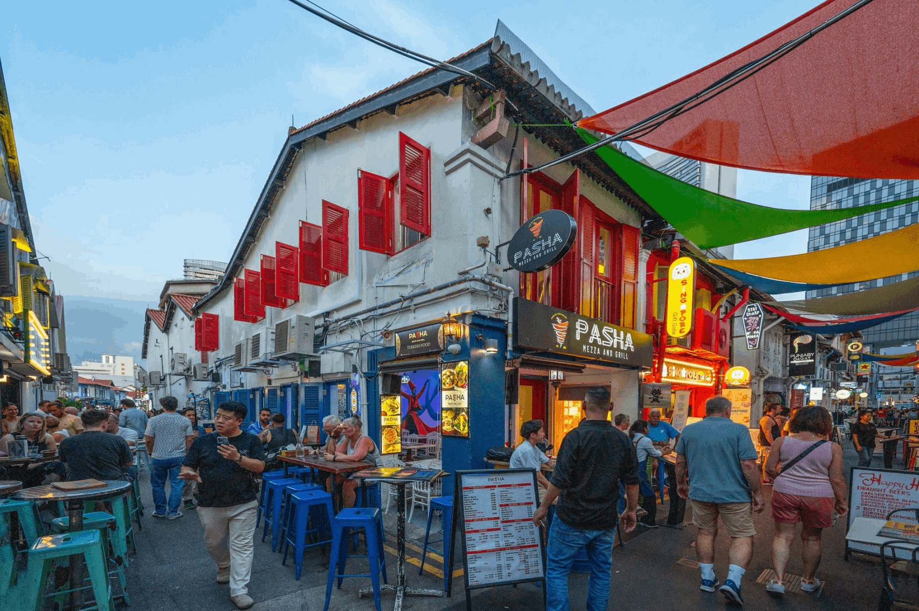 Haji Lane in Kampong Gelam with colourful heritage shophouses, restaurants and street scenes, a budget-friendly cultural area to explore in Singapore.
