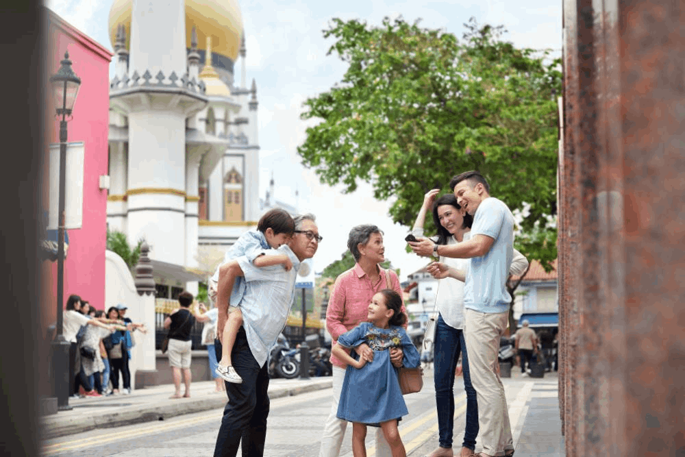 Family visiting the iconic Sultan Mosque in Kampong Gelam, Singapore, during Hari Raya Haji.