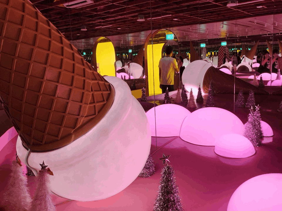 A colourful interactive installation inside the Museum of Ice Cream Singapore, featuring oversized ice cream displays and pink-themed rooms.