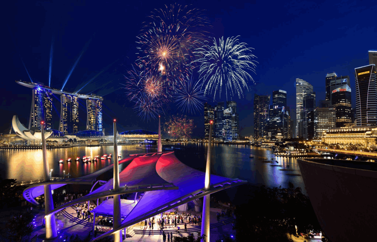 Spectacular fireworks light up the sky above Marina Bay Sands and the Singapore Flyer during National Day celebrations.