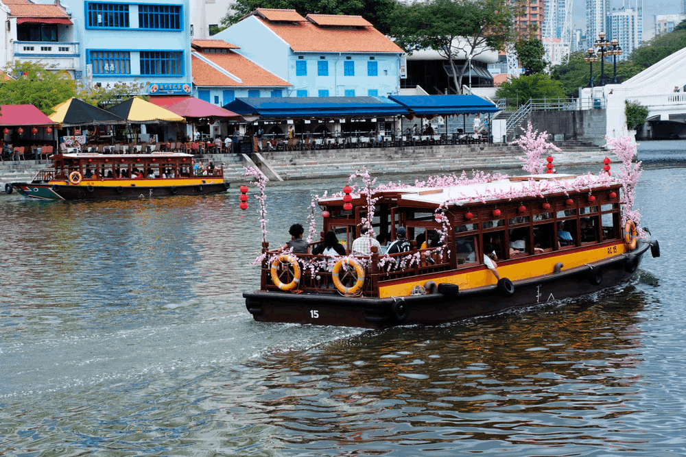 Family enjoying the river cruise in Singapore during Hari Raya Haji.
