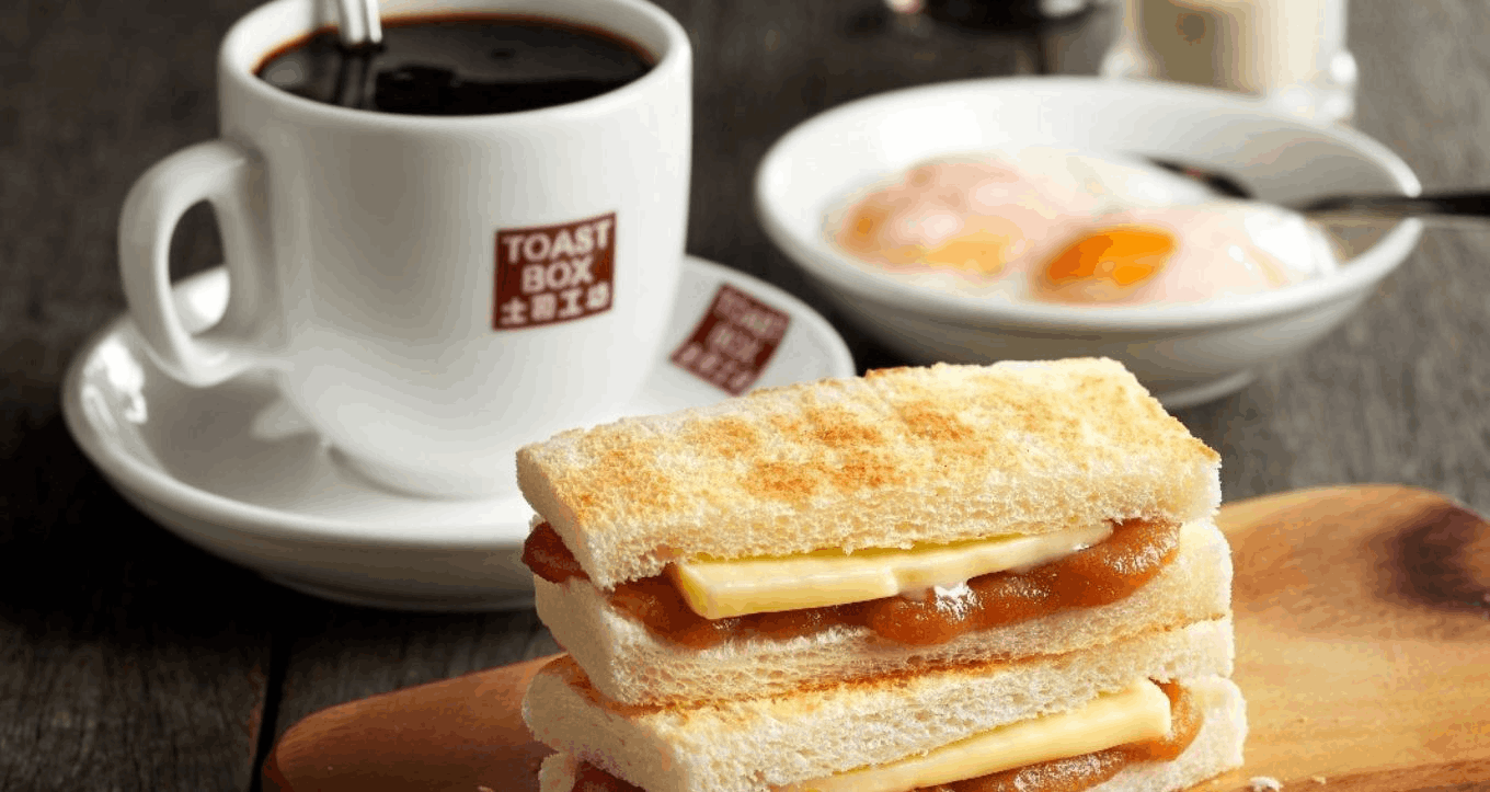 Traditional Singaporean kaya toast with soft-boiled eggs and coffee – a local breakfast experience loved by Indian tourists visiting Singapore